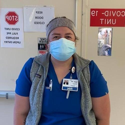 LR alumna Milly Treu wearing a mask in a COVID-19 unit.