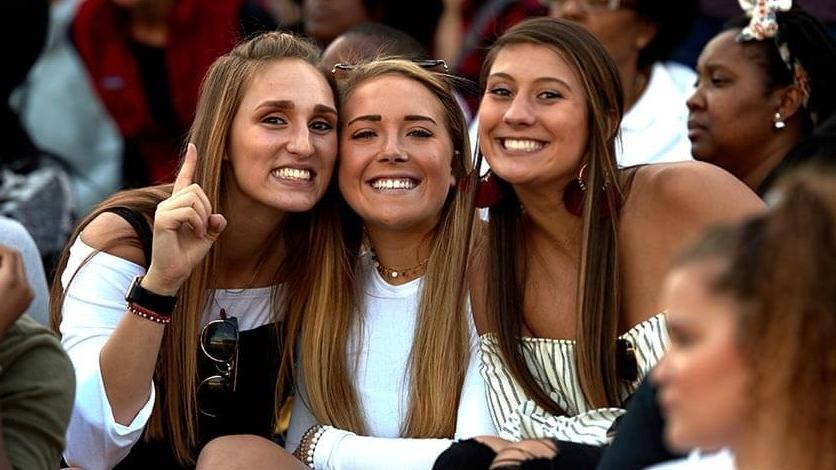 Friends smiling at a game